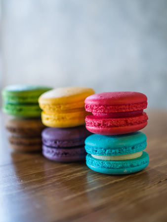 Macaron in plate on wood tableの写真素材