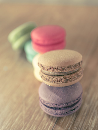Macaron in plate on wood tableの写真素材