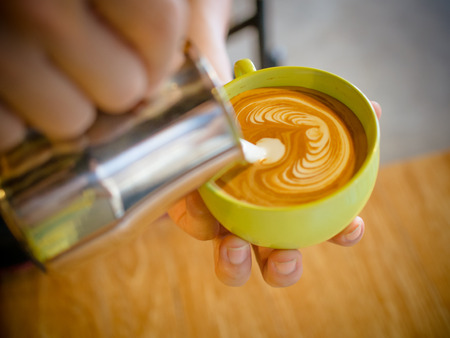 coffee latte art cup in cafeの写真素材
