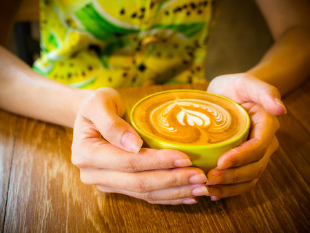 coffee latte art cup in cafeの写真素材