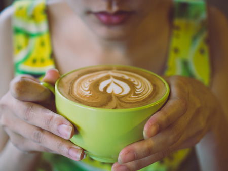 coffee latte art cup in cafeの写真素材