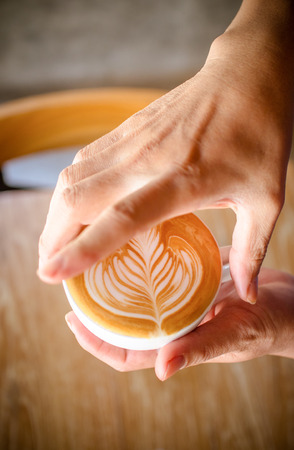 Cup of coffee latte in coffee shopの写真素材