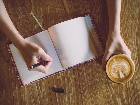 Cup of coffee latte in coffee shopの写真素材