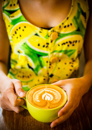 coffee latte art cup in cafeの写真素材