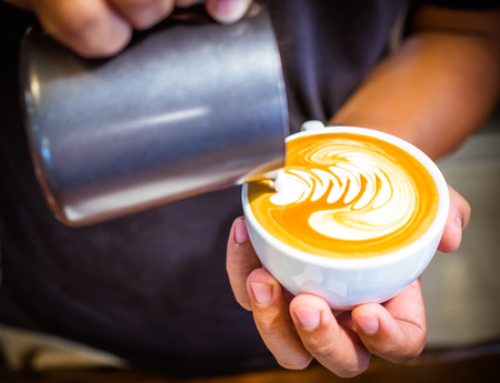 Cup of coffee latte in coffee shopの写真素材