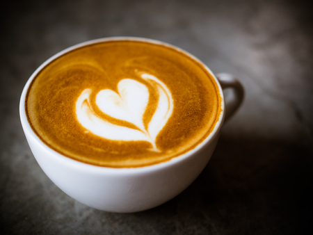 Cup of coffee latte in coffee shopの写真素材