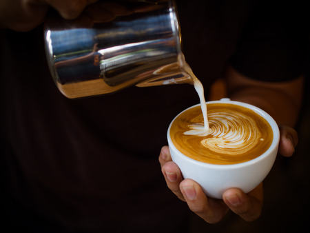Cup of coffee latte in coffee shopの写真素材