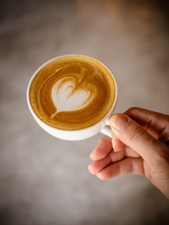 Cup of coffee latte in coffee shopの写真素材