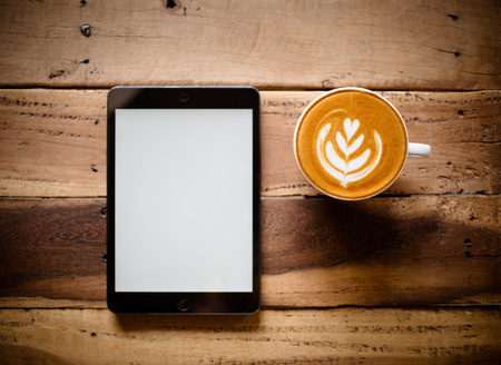 smartphone and coffee on wood blank spaceの写真素材
