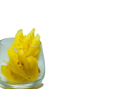 Pineapple put in cup on white backgroundの写真素材