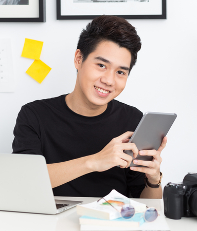 Smart Young Asian Workingの写真素材