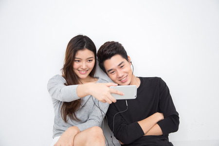Young Asian Couple Selfieの写真素材