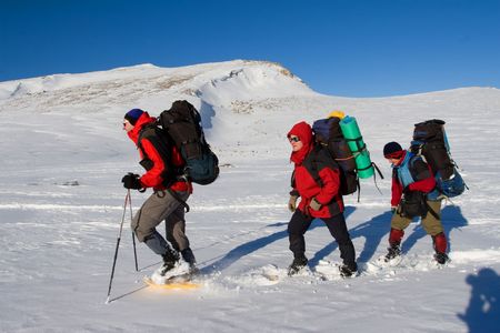 Hiker are in winter in mountainsの写真素材