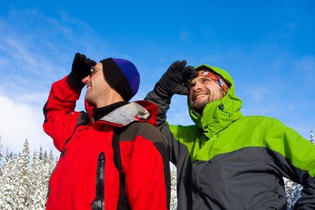 Hikers are in winter in mountainsの写真素材