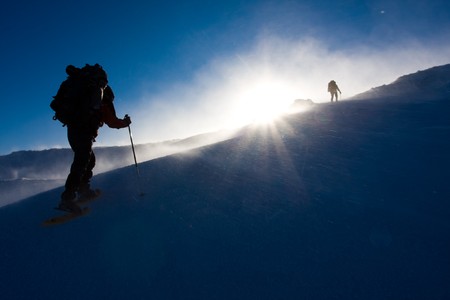 Hiker are in winter in mountainsの写真素材