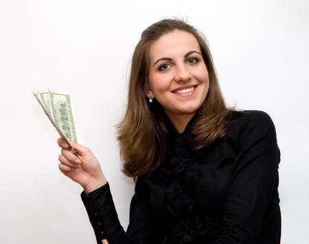 Beautiful business  woman holding money and smilingの写真素材
