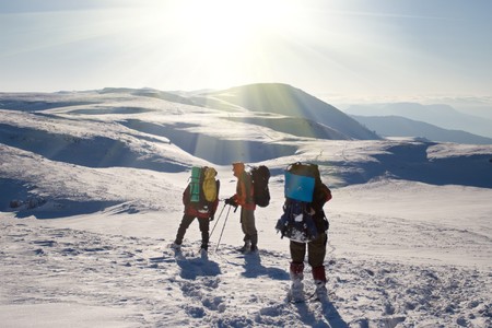 Hiker are in winter mountainsの写真素材