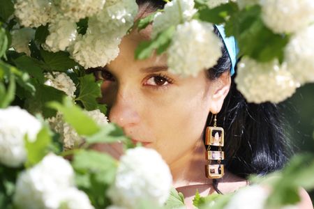 a portrait of beautiful woman is in flowers