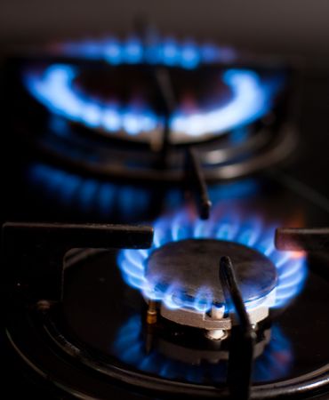 Blue flames of gas stove in the dark

の写真素材