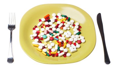 pills on green  plateの写真素材