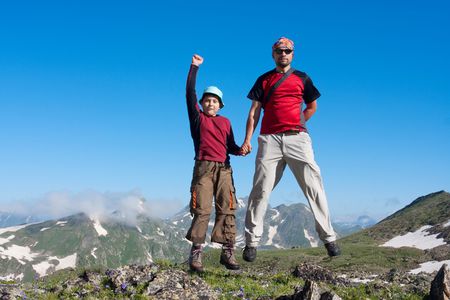 Happy family in Caucasus mountainsの写真素材