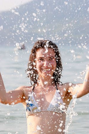 Woman plays in waterの写真素材