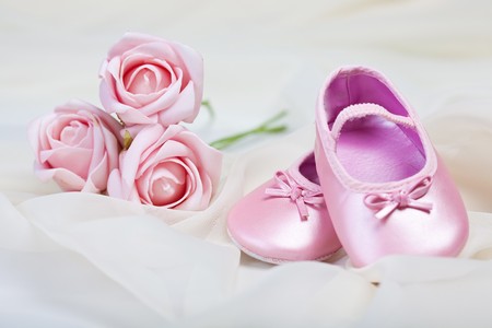 Pink baby shoes whith flowerの写真素材