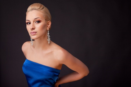 Bautiful woman in blue on black background の写真素材