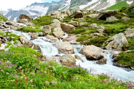 Mountain waterfall with clear blue waterの写真素材