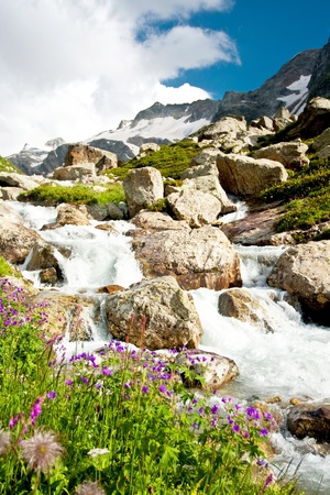 Mountain waterfall with clear blue waterの写真素材