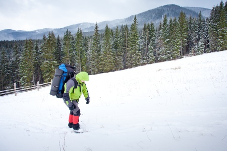 Hiker in winter mountains