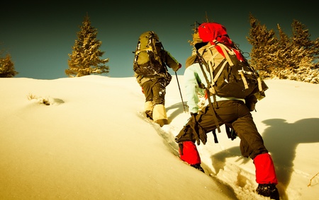Hiker in winter mountainsの写真素材
