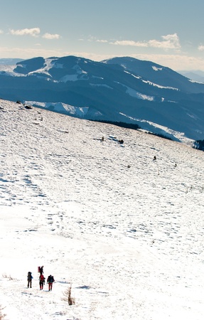 Hiker in winter mountainsの写真素材