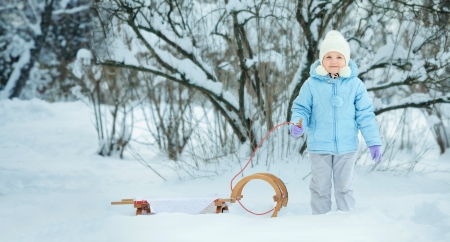 Little girl on sledgeの写真素材