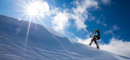 Hiker in winter mountains snowshoeingの写真素材