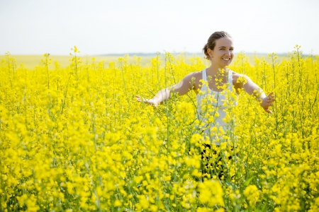 Woman in rapeseed field 