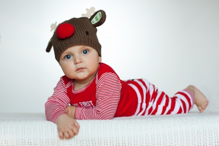 cute baby boy in funny deer costume on white backgroundの写真素材
