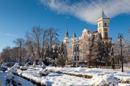 Old fairytale palace in winter during sunny dayの写真素材
