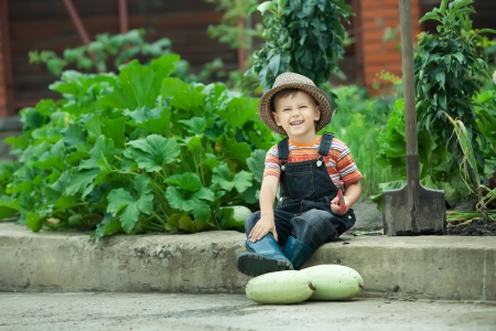 Portrait of a boy working in the garden in holidayの写真素材