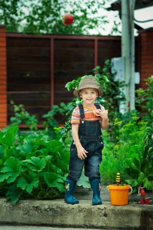 Portrait of a boy working in the garden in holidayの写真素材