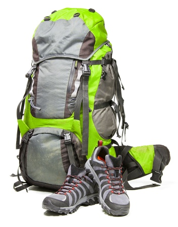 Hiking shoes and packed backpack on white backgroundの写真素材
