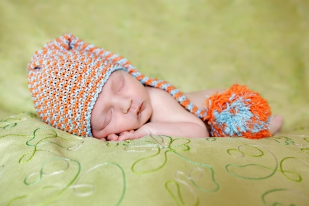 Caucasian newborn baby while sleeping closeup の写真素材