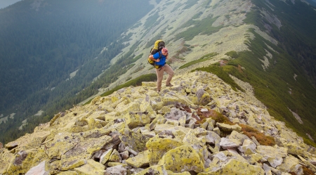 Hiker makes his way in Carpathian mountainsの写真素材