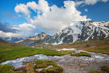 Beautiful mountain lake with reflection of nearest mountainsの写真素材