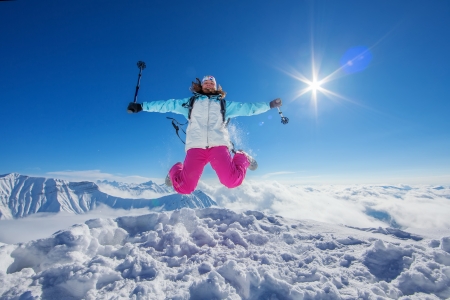 Hiker in winter Caucasus mountains in Georgia, Gudauriの写真素材