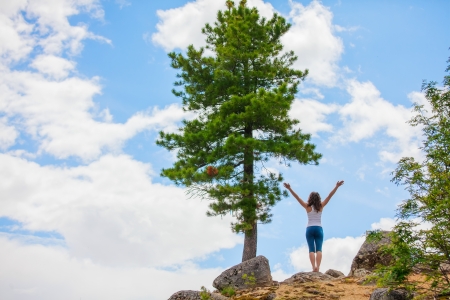 Young woman is practicing yoga in high mountainsの写真素材