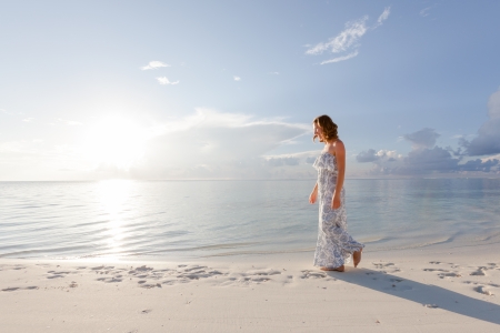 Caucasian woman rests at beautiful seashoreの写真素材