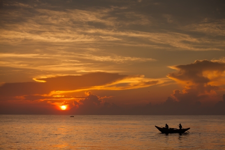 Scenic view at Indian ocean at Sri Lanka with fishman in boatの写真素材