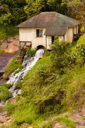 Old watermill on mountain riverの写真素材