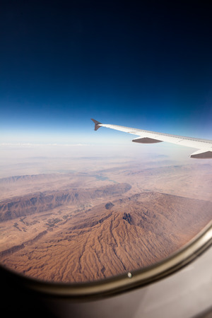 View at the earth from window of airplaneの写真素材